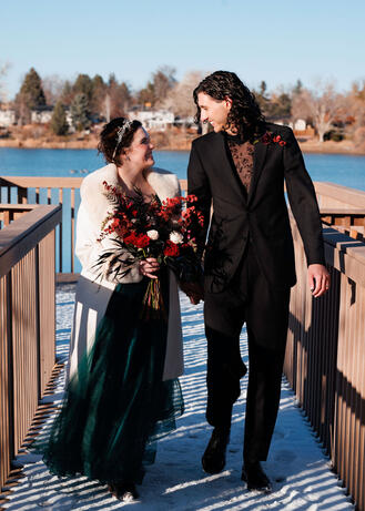 A photo of a recently married couple walking down the aisle together on their elopement day.